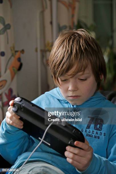 Boy playing Wii U
