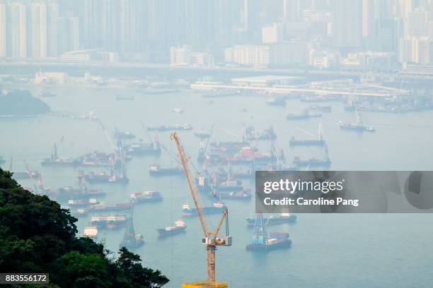 poor visibility of kowloon bay on a day covered with smog. - caroline pang stock pictures, royalty-free photos & images