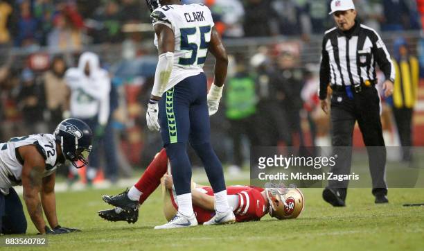 Beathard of the San Francisco 49ers lays on the ground with a knee injury during the game against the Seattle Seahawks at Levi's Stadium on November...