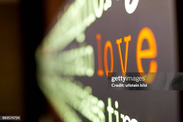 Word cloud on the wall of Burger lounge, which praises its burgers as "grass-fed burgers.