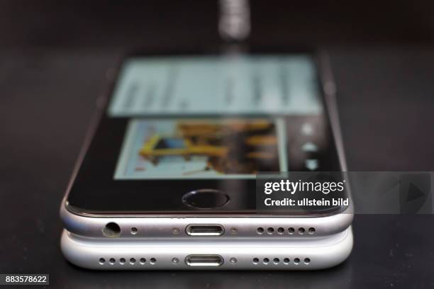 IPhone 6, on top of an iPhone 7, which comes without a headphone jack, instead using the lightning connector for earbuds.