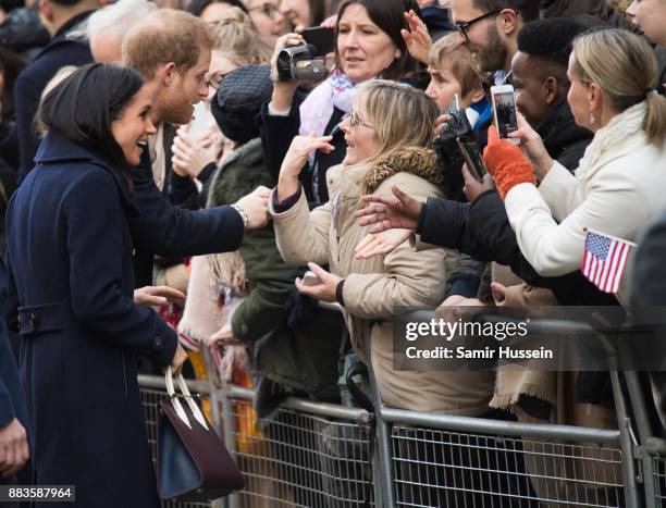 Prince Harry and Meghan Markle go on a walk about at Nottingham Contemporary on December 1, 2017 in Nottingham, England. Prince Harry and Meghan...