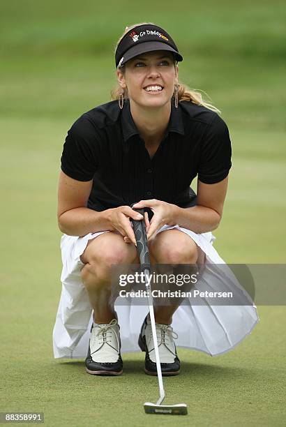 Anna Rawson of Australia lines up her putt on the first hole green during the fourth round of the LPGA State Farm Classic golf tournament at Panther...