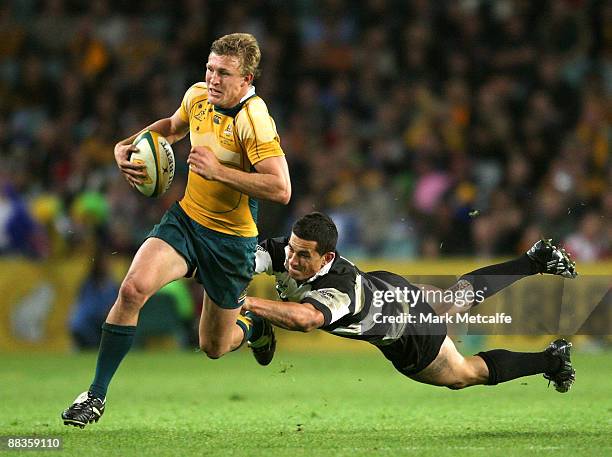 Sonny Bill Williams of the Barbarians attempts to tackle Lachie Turner of the Wallabies during the Nick Shehadie Cup match between the Australian...