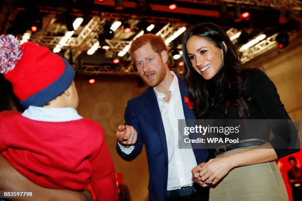 Prince Harry and his fiancee US actress Meghan Markle visit the Terrence Higgins Trust World AIDS Day charity fair at Nottingham Contemporary on...