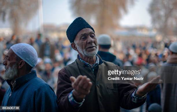 Kashmiri Muslim devotees pray, at Hazratbal shrine on the Eid-e-Milad , or the birth anniversary of Prophet Mohammad on December 1, 2017 in Srinagar,...