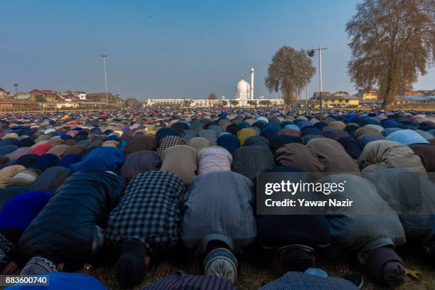 Kashmiri Muslim devotees pray, at Hazratbal shrine on the Eid-e-Milad , or the birth anniversary of Prophet Mohammad on December 1, 2017 in Srinagar,...