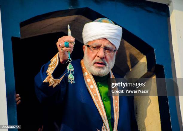 Kashmiri Muslim cleric displaying the holy relic believed to be the whisker from the beard of the Prophet Mohammed, at Hazratbal shrine on the...