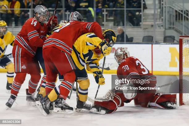 Ohio State Buckeyes goalie Sean Romeo stretches to stop a shop during a regular season Big 10 Conference hockey game between the Ohio State Buckeyes...