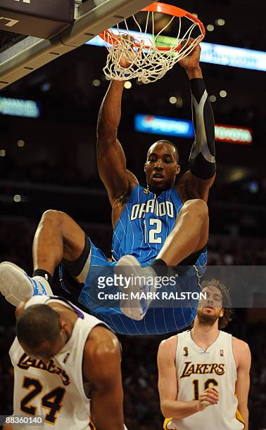 Kobe Bryant of the Los Angeles Lakers fails to stop Dwight Howard of Orlando Magic from scoring during game two of the NBA finals at the Staples...
