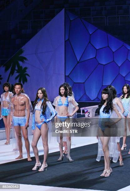 Models present creations from the Hosa Cup China Swimming Wear Design Contest at the National Aquatics Center, also known as the Water Cube, in...