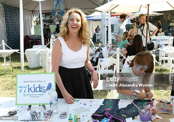 Actress Virginia Madsen and child attend the A Time for Heroes Celebrity Carnival Sponsored by Disney, benefiting the Elizabeth Glaser Pediatric AIDS...