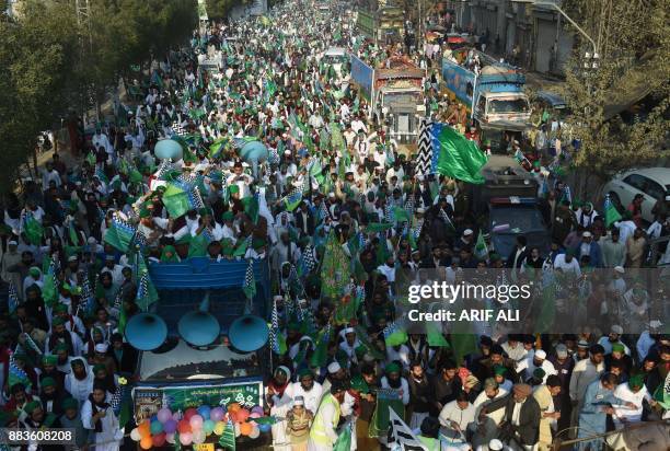 Pakistani Sunni Muslim march in a rally during celebrations marking Eid-e-Milad-un-Nabi, the birthday of Prophet Mohammad, in Lahore on December 1,...