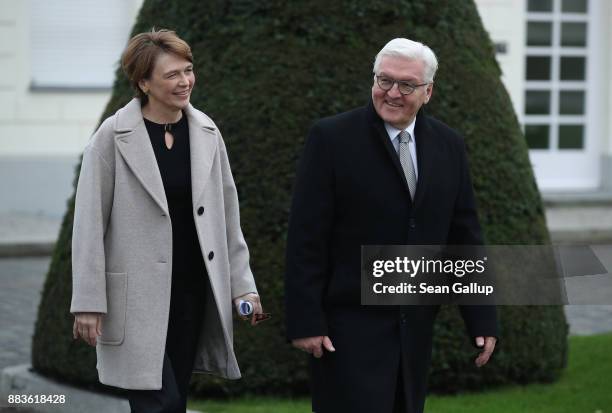 German President Frank-Walter Steinmeier and First Lady Elke Buendenbender arrive to greet children on the lawn of Schloss Bellevue presidential...