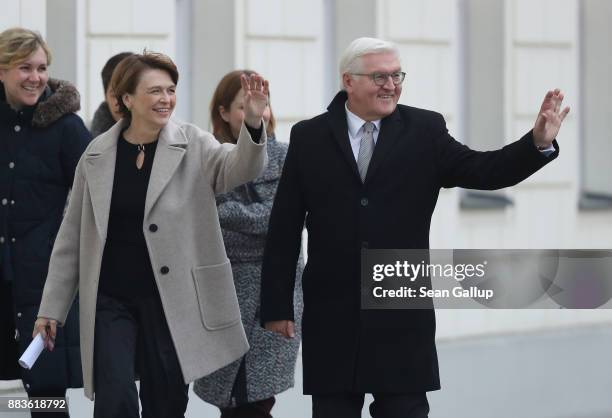 German President Frank-Walter Steinmeier and First Lady Elke Buendenbender wave as they arrive to greet children on the lawn of Schloss Bellevue...