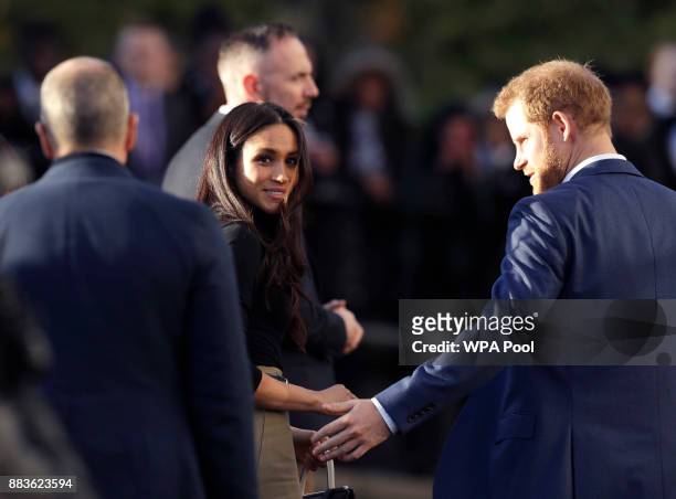 Prince Harry and his fiancee US actress Meghan Markle leave after watching a hip hop opera performed by young people involved in the Full Effect...