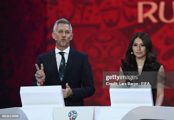 Presenter, Gary Lineker and Presenter, Maria Komandnaya speak to the audience during the Final Draw for the 2018 FIFA World Cup Russia at the State...