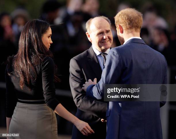 Prince Harry and his fiancee US actress Meghan Markle leave after watching a hip hop opera performed by young people involved in the Full Effect...