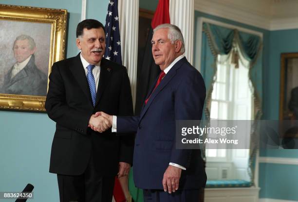 Secretary of State Rex Tillerson participates in a photo op with Libyan Prime Minister Fayez al-Sarraj at the State Department December 1, 2017 in...