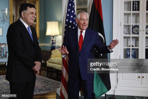 Rex Tillerson, U.S. Secretary of State, right, speaks to members of the media as Fayez al-Sarraj, Libya's prime minister, smiles before a meeting at...