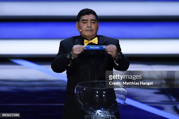 Draw assistant, Diego Maradona draws England during the Final Draw for the 2018 FIFA World Cup Russia at the State Kremlin Palace on December 1, 2017...