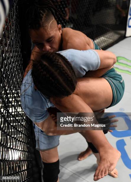 Sijara Eubanks knees Roxanne Modafferi during the filming of The Ultimate Fighter: A New World Champion at the UFC TUF Gym on August 18, 2017 in Las...