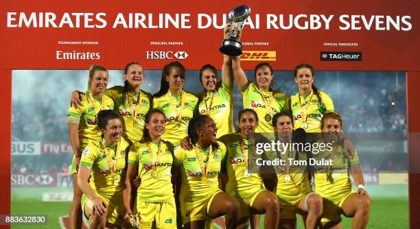 Team of Australia Women's Rugby Sevens team celebrate with the trophy after winning the Cup Final match against United States on Day Two of the...