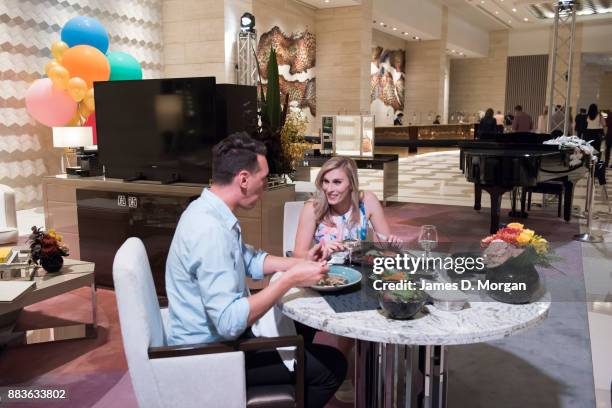 Bec Ormond and Mike Pinker inside a live art installation in the hotel lobby of Crown Towers Perth on December 1, 2017 in Perth, Australia. As part...