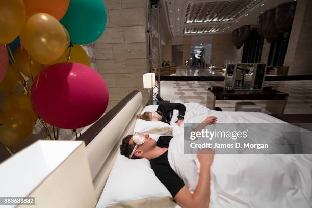 Bec Ormond and Mike Pinker inside a live art installation in the hotel lobby of Crown Towers Perth on December 1, 2017 in Perth, Australia. As part...