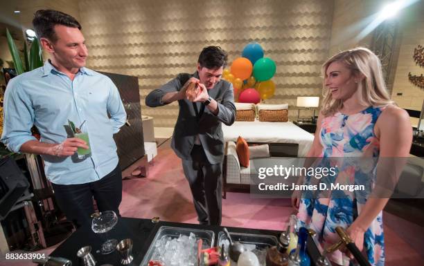 Bec Ormond and Mike Pinker inside a live art installation in the hotel lobby of Crown Towers Perth on December 1, 2017 in Perth, Australia. As part...