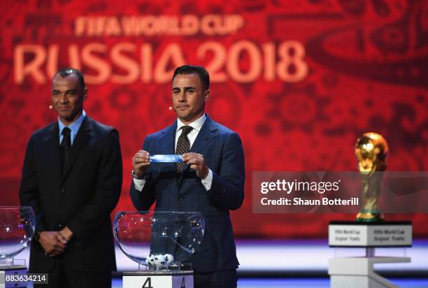 Draw assistant, Fabio Cannavaro draws Australia during the Final Draw for the 2018 FIFA World Cup Russia at the State Kremlin Palace on December 1,...