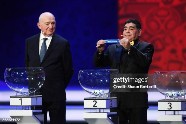 Draw assistant, Diego Maradona draws Switzerland during the Final Draw for the 2018 FIFA World Cup Russia at the State Kremlin Palace on December 1,...