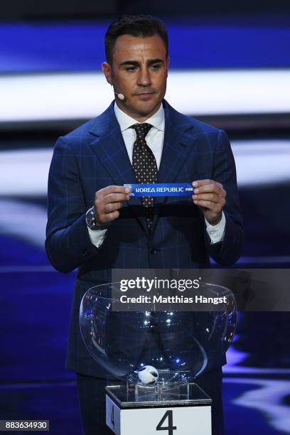 Draw assistant, Fabio Cannavaro draws South Korea during the Final Draw for the 2018 FIFA World Cup Russia at the State Kremlin Palace on December 1,...