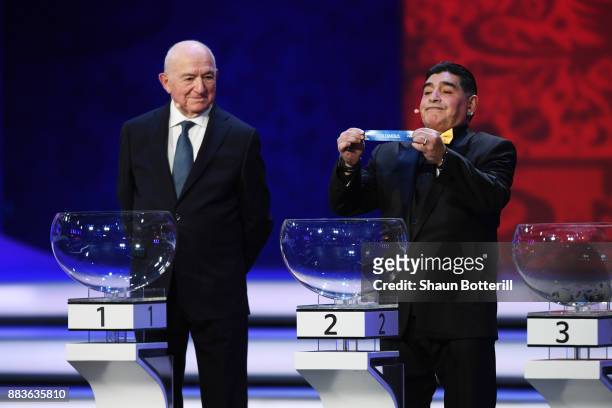 Draw assistant, Diego Maradona draws Colombia during the Final Draw for the 2018 FIFA World Cup Russia at the State Kremlin Palace on December 1,...