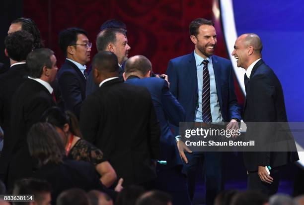 Gareth Southgate, Manager of England speaks to Roberto Martinez, Manager of Belgium during the Final Draw for the 2018 FIFA World Cup Russia at the...