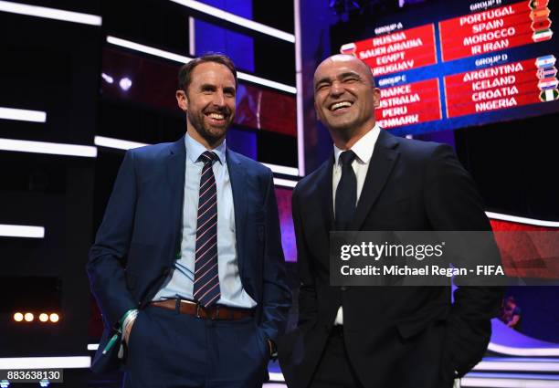 Gareth Southgate, Manager of England speaks to Roberto Martinez, Manager of Belgium during the Final Draw for the 2018 FIFA World Cup Russia at the...