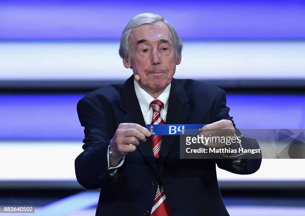 Draw assistant, Gordon Banks draws B4 during the Final Draw for the 2018 FIFA World Cup Russia at the State Kremlin Palace on December 1, 2017 in...