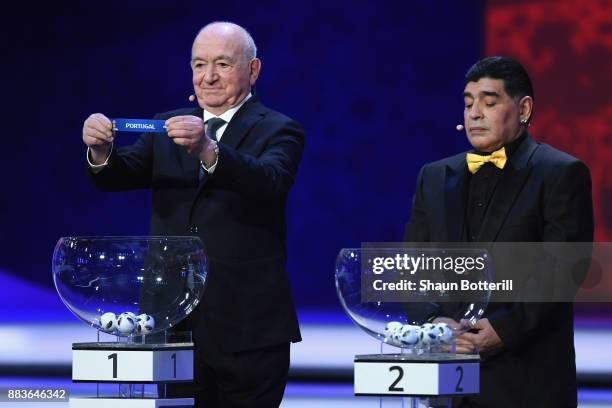 Draw assistant, Nikita Simonyan draws Portugal during the Final Draw for the 2018 FIFA World Cup Russia at the State Kremlin Palace on December 1,...