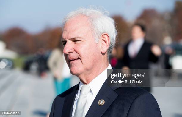 Rep. Bradley Byrne, R-Ala., stops to speak with a reporter as he walks down the House steps following a vote in the Capitol on Friday, Dec. 1, 2017.