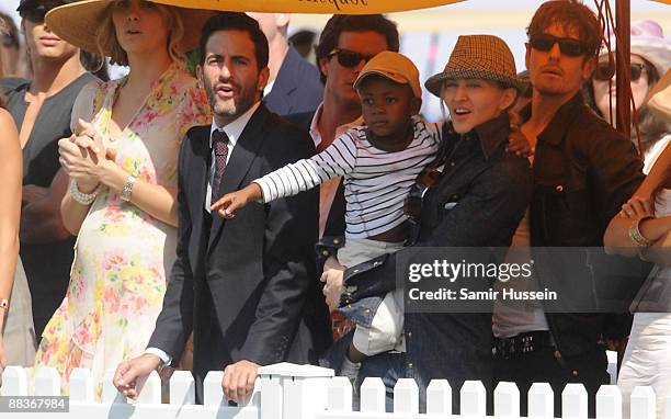 Marc Jacobs and Madonna with her son David watch the 2009 Veuve Clicquot Manhattan Polo Classic on Governor's Island on May 30, 2009 in New York City.