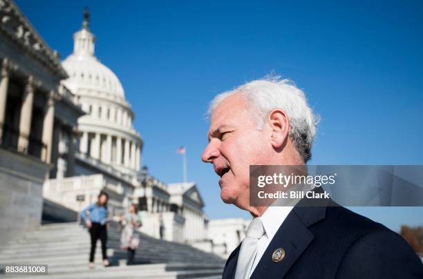 Rep. Bradley Byrne, R-Ala., stops to speak with a reporter as he walks down the House steps following a vote in the Capitol on Friday, Dec. 1, 2017.