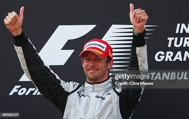 Jenson Button of Great Britain and Brawn GP celebrates on the podium after winning the Turkish Formula One Grand Prix at Istanbul Park on June 7 in...