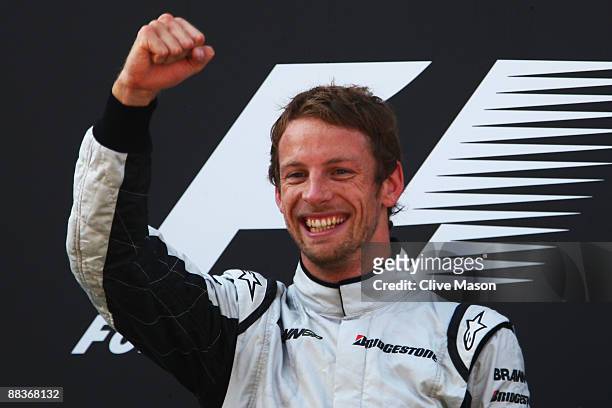 Jenson Button of Great Britain and Brawn GP celebrates on the podium after winning the Turkish Formula One Grand Prix at Istanbul Park on June 7 in...