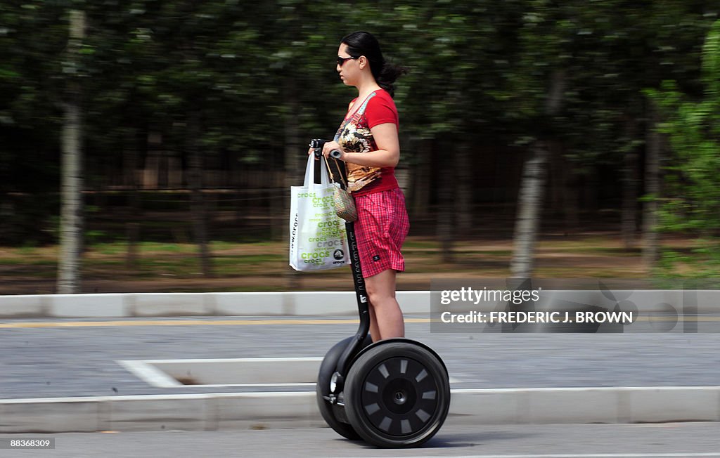 A woman commutes on a Segway personal tr