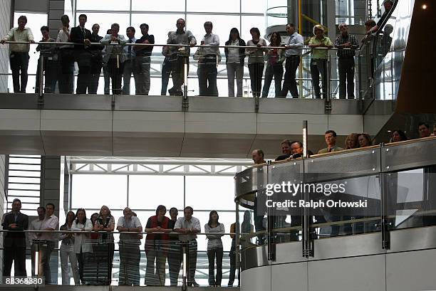 Employees of German carmaker Opel listen to a news conference held at their headquarters on June 9, 2009 in Ruesselsheim, Germany. Roland Koch,...