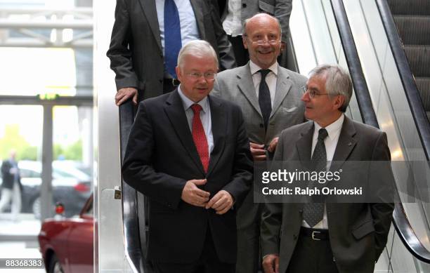 Roland Koch, governor of the German state of Hesse, Dieter Posch, Hesse Economy Minister and Hans Demant, chief of Adam Opel GmbH arrive for a news...