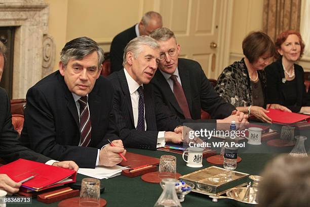 Prime Minister Gordon Brown , prepares to chair a cabinet meeting beside Justice Minister Jack Straw , Environment Secretary Hilary Benn , Cabinet...