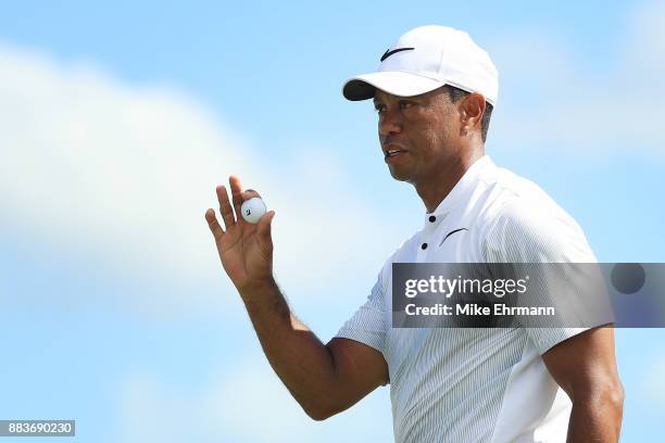 Tiger Woods of the United States reacts to his birdie on the third green during the second round of the Hero World Challenge at Albany, Bahamas on...