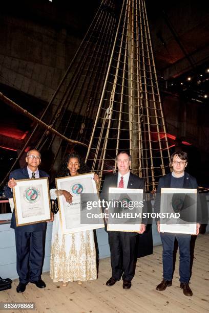 Right Livelihood Award laureates Colin Gonsalves, Yetnerbesh Nigussie, Robert Bilott and a representative for Khadidja Ismayilova receive their...