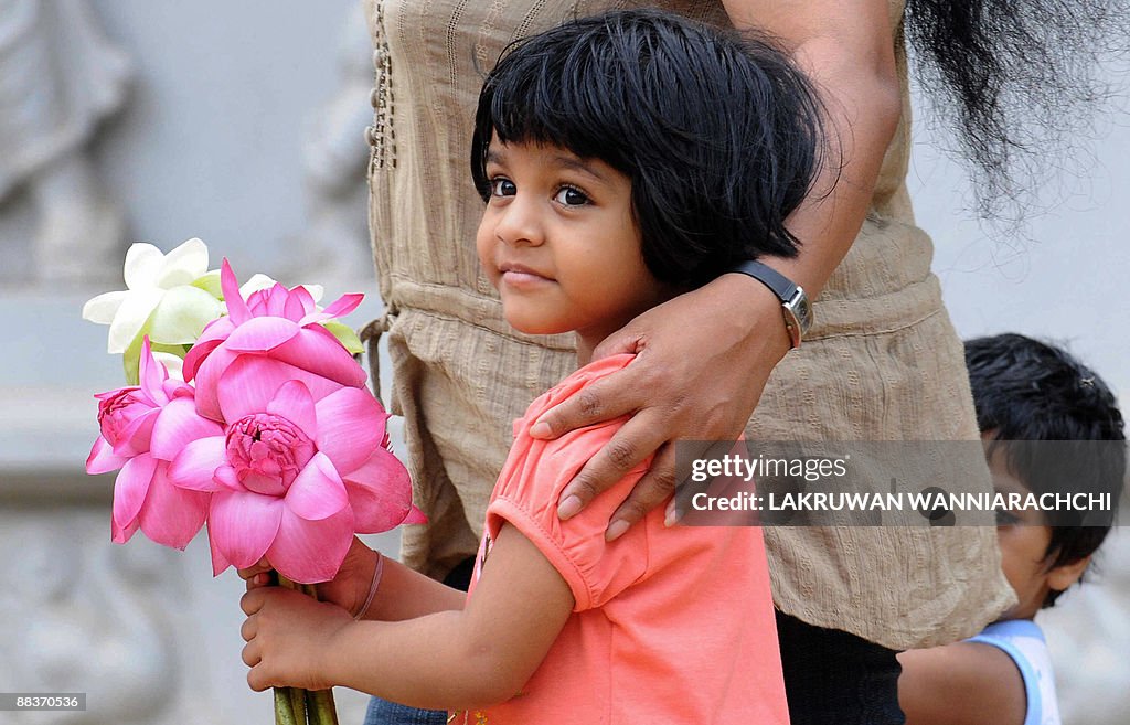 Sri Lankan Buddhist devotees offer praye